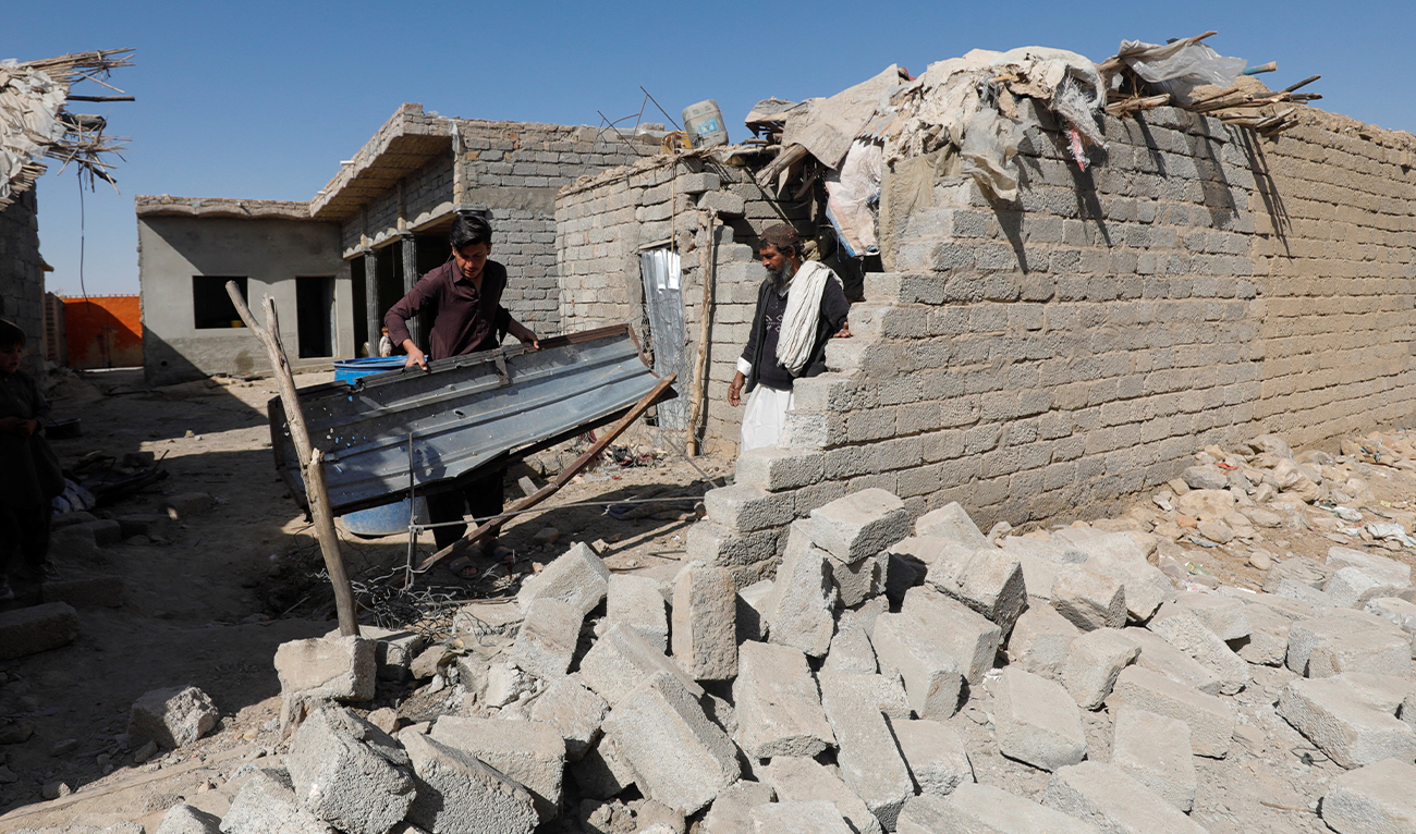 Residents inspect the damage after what locals say was a possible drone that hit a residential house in the Sarah Gharghai area, in Quetta, Pakistan, March 14, 2026. (REUTERS)