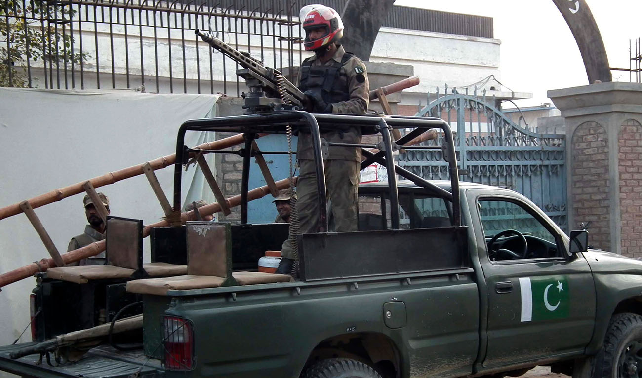 Security forces stand guard at the site of a suicide bomb blast in Bannu December 10, 2012. Four Taliban suicide bombers attacked a police station in northwest Pakistan on Monday, killing at least eight policemen and local residents, security officials said. (Reuters/File)