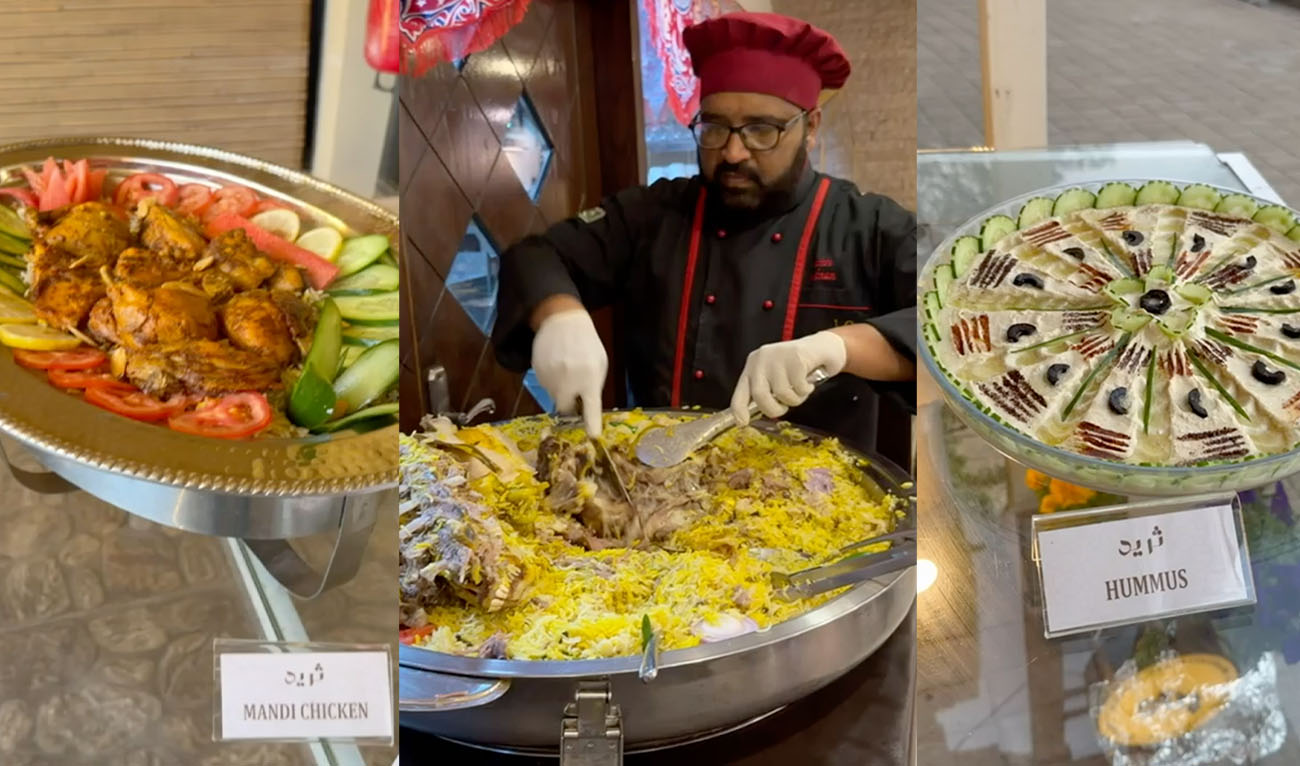 This picture taken on Feb. 25, 2026, shows a chef serving traditional Middle Eastern slow-cooked rice (center) as a variety of Arab dishes are displayed (left and right) at a restaurant in Islamabad, Pakistan. (AN Photo)