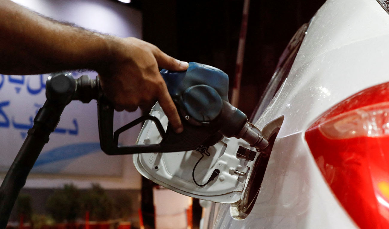 A worker seals the Pakistan State Oil tanker's lid at the fuel storage facility in Sheikhupura district in Lahore on March 10, 2026.(AFP/File)