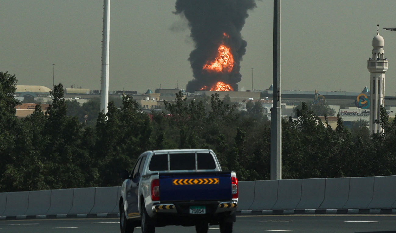 A smoke plume rise from an ongoing fire near Dubai International Airport in Dubai on March 16, 2026. (AFP)