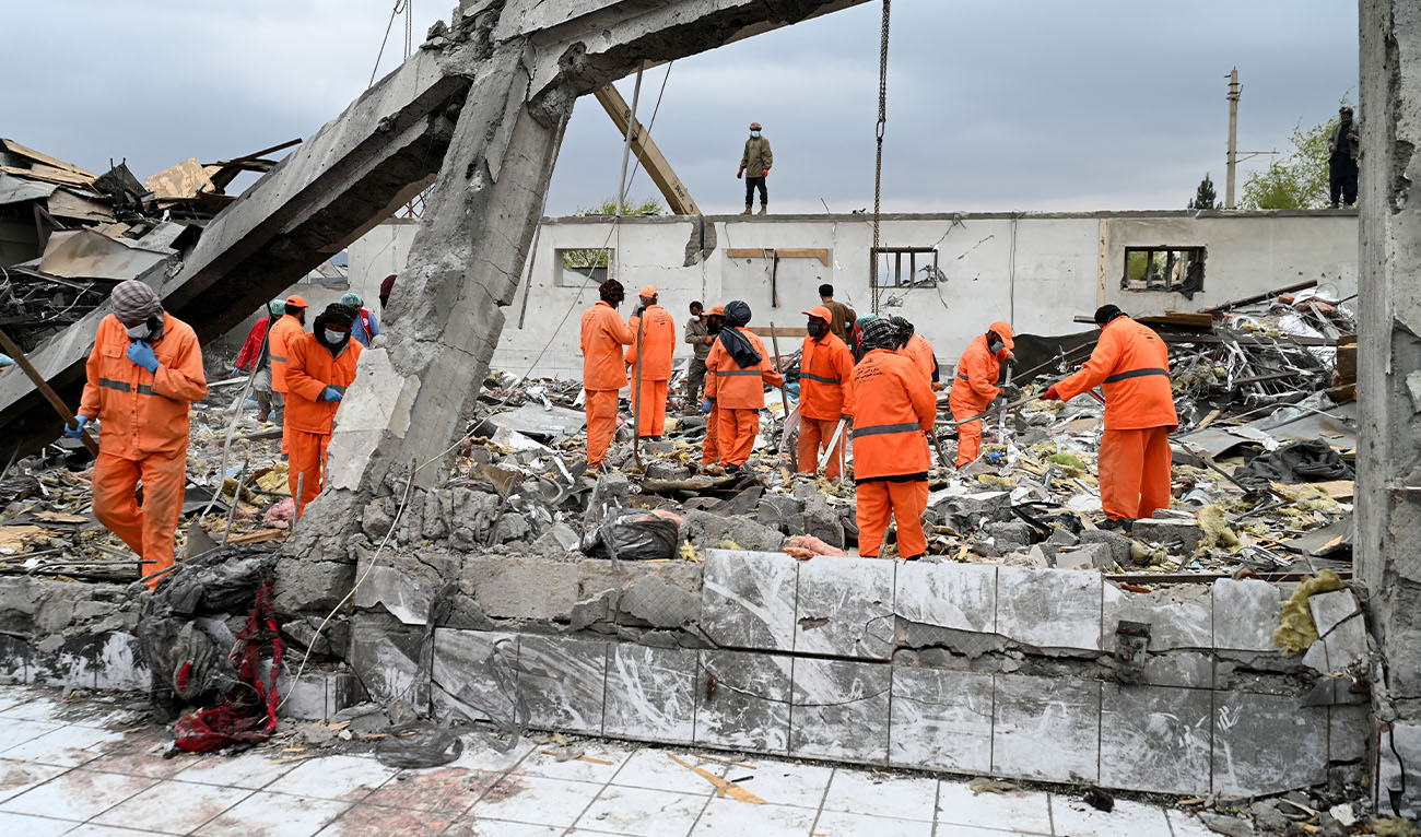 Afghan municipality workers clear debris from the site after Pakistani airstrikes hit the Omid Addiction Treatment Hospital in Kabul, on March 17, 2026. (AFP)