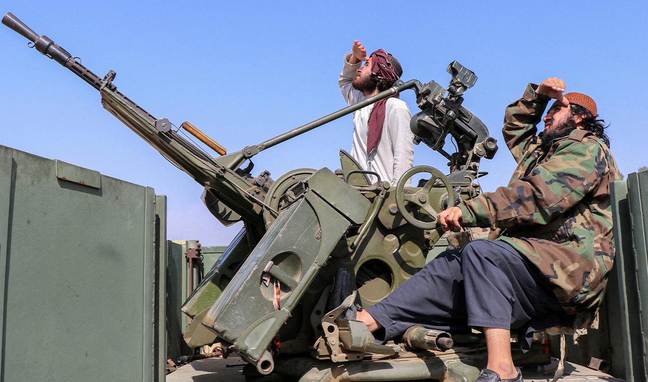 Taliban soldiers sit next to an anti-aircraft gun while on lookout for Pakistan's fighter jets, in Khost province, Afghanistan, February 27, 2026. (Reuters/File)