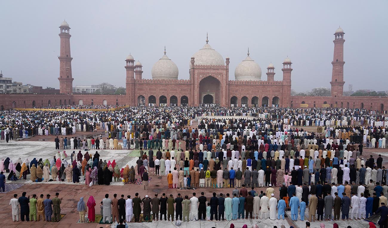 Muslims perform Eid al-Fitr prayer, marking the end of the Muslim's holy fasting month of Ramadan, at the historical Badshahi Mosque in Lahore, Pakistan, Saturday, March 21, 2026. (AP)