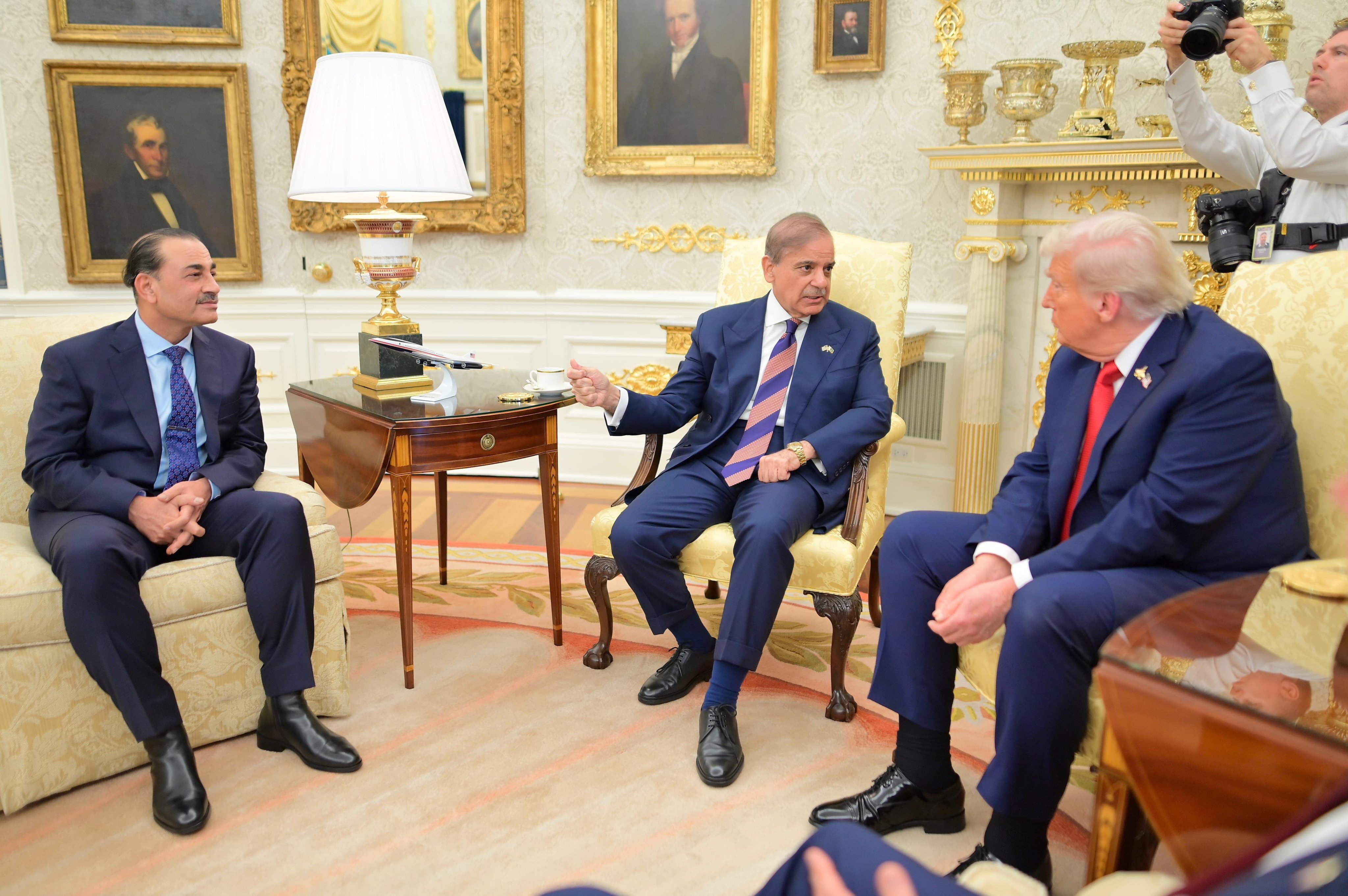 Pakistan Prime Minister Shehbaz Sharif speaks during a meeting with US President Donald Trump (right), as Pakistan Army Chief Field Marshal Asim Munir (left) gestures, at the Oval Office in Washington, US, on September 25, 2025. (Handout/PMO)