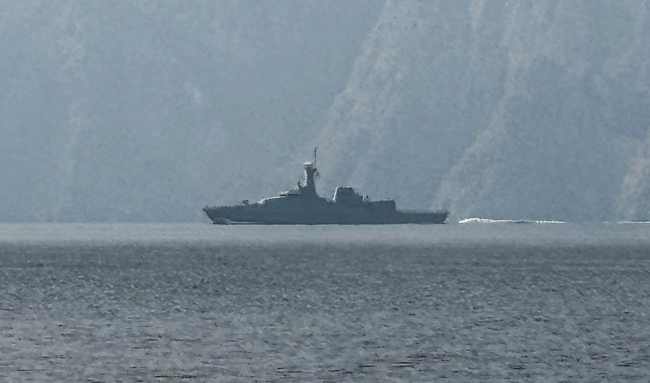 A navy vessel is seen sailing in the Strait of Hormuz, a vital waterway through which much of the world's oil and gas passes on March 1, 2026. (AFP/File)