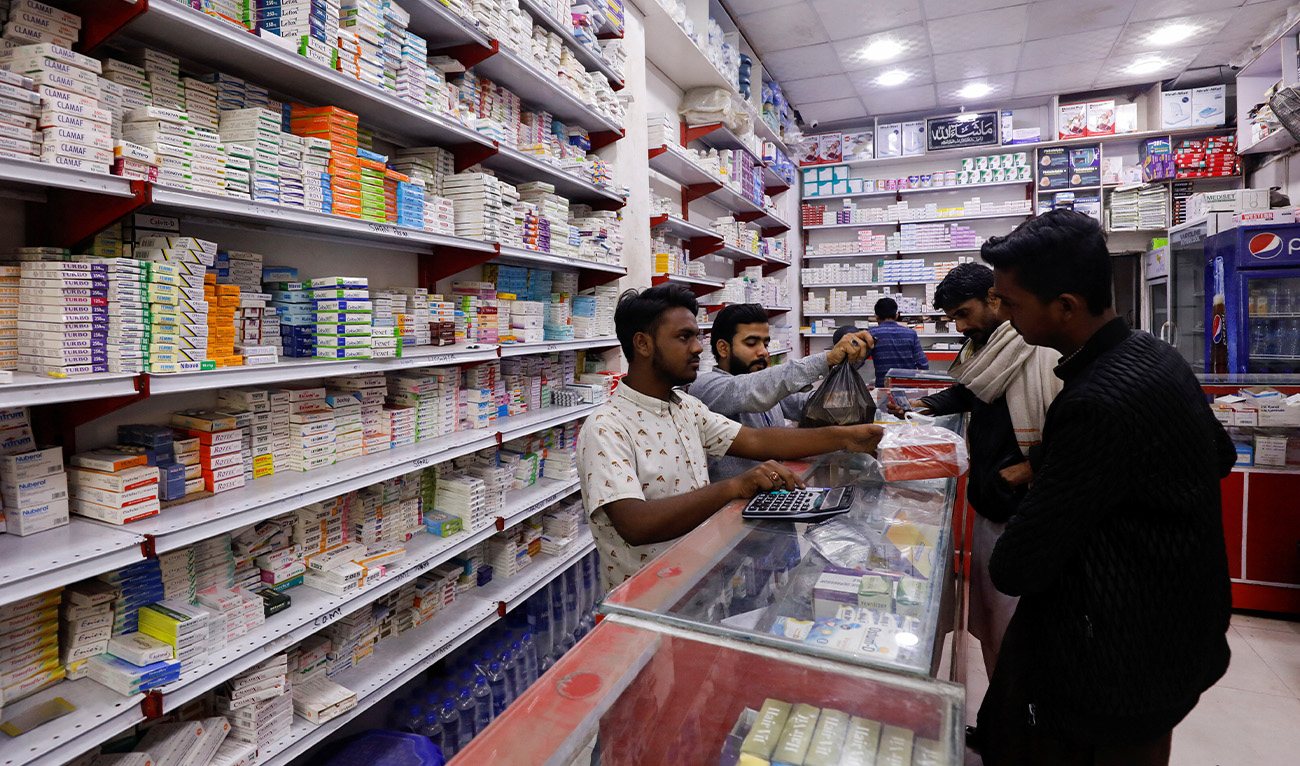 Customers buy medicine from a medical supply store in Karachi, Pakistan February 9, 2023. (Reuters/File)