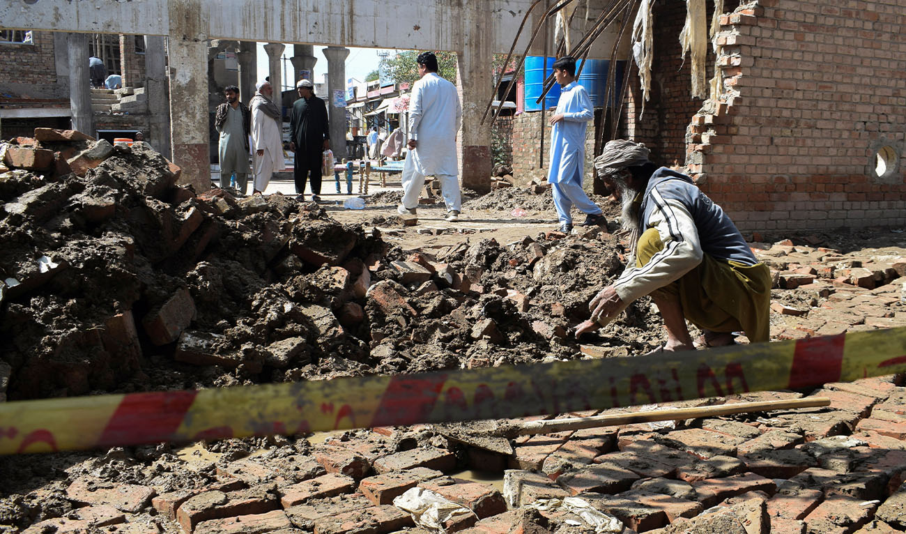 A man clears the rubble of his damaged house, collapsed after heavy rains in Bannu, Khyber Pakhtunkhwa province, in Pakistan March 30, 2026. (Reuters)