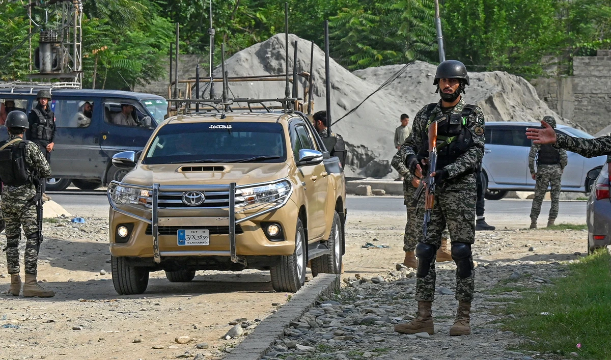 Security personnel stand guard at the site of a bomb blast in Bajaur district of Khyber-Pakhtunkhwa province on July 31, 2023. (AFP/File)