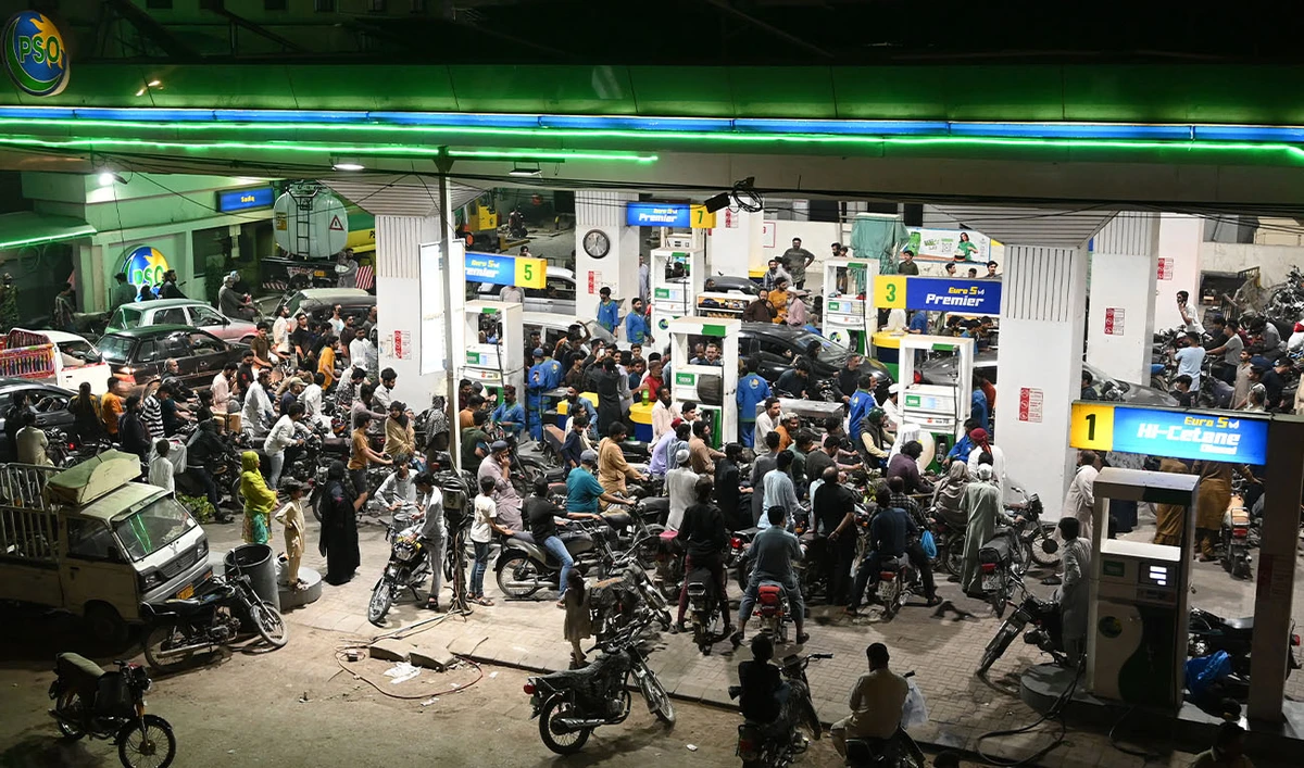 Clients queue at a gas station amid rising petrol prices in Karachi on March 7, 2026. (AFP/File)