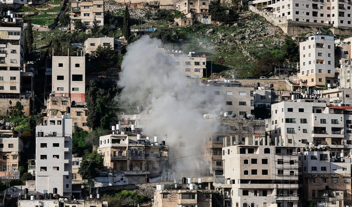 Smoke rises as Israeli authorities demolish the house of Mahmoud al-Aqqad, a Palestinian man who was killed last year near Qalqilyah after reportedly killing an Israeli soldier, in the occupied West Bank city of Nablus on March 28, 2026. (AFP/File)