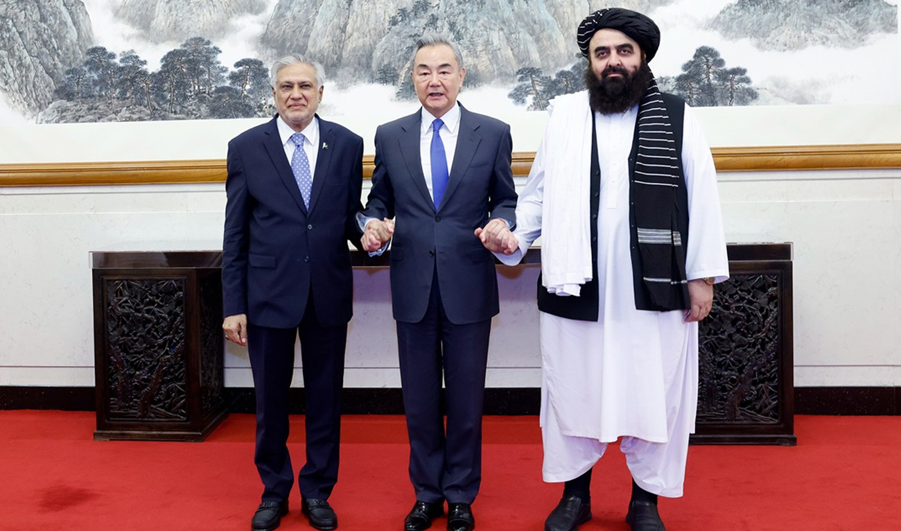 Afghanistan’s acting Foreign Minister Amir Khan Muttaqi, Chinese Foreign Minister Wang Yi (center), and Pakistan’s Foreign Minister Ishaq Dar (left), pose for a group photo as they meet in Beijing, China, on May 21, 2025. (Handout/Ministry of Foreign Affairs of the People’s Republic of China/File)
