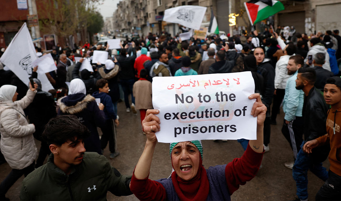 Protesters gather outside the entrance of Yarmouk refugee camp to condemn the Israeli death penalty law for Palestinians convicted of lethal attacks, in Damascus, Syria, April 1, 2026. (Reuters)