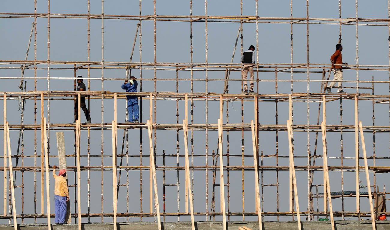 Workers are seen working at a construction site of a new project in Dubai on November 5, 2017. (AFP)