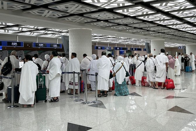 Pilgrims wait to pass through immigration they arrive for the annual Hajj in Makkah at Jeddah International Airport on June 10, 2024. (AFP/ file)