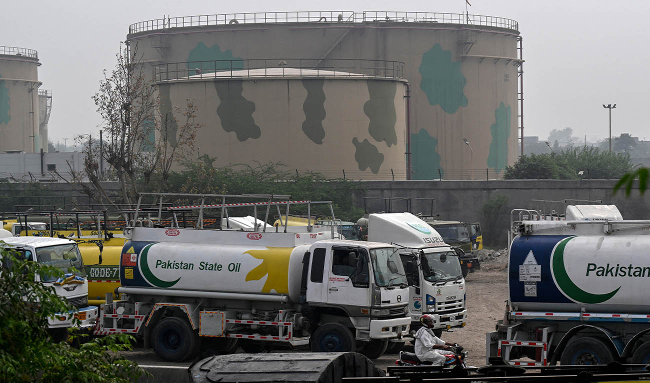 Pakistan State Oil tankers line up along a road before entering a fuel storage facility in Sheikhupura district in Lahore on March 10, 2026. (AFP/ file)