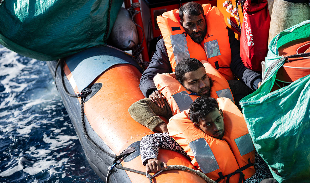 Migrants sit onboard a RHIB (Rigid inflatable boat) of the “Ocean Viking” rescue ship after being evacuated from the Sider, a merchant ship, in the search-and-rescue zone in international waters off the coast of Libya, on January 17, 2026. (AFP/ file)