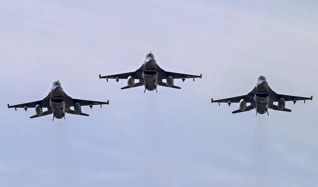 Pakistan Air Force F-16 fighter jets fly past over the President's House during the national day parade in Islamabad on March 23, 2025. (AFP/File)