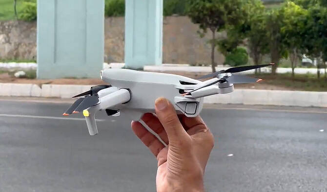 Screengrab from a video released by Islamabad Capital Police on July 2, 2025, showing a drone held in hand. (@ICT_Police/X)