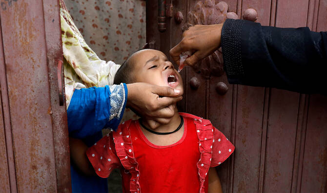 A girl receives polio vaccine drops, during an anti-polio campaign in Karachi, Pakistan, on July 20, 2020. (REUTERS/File)