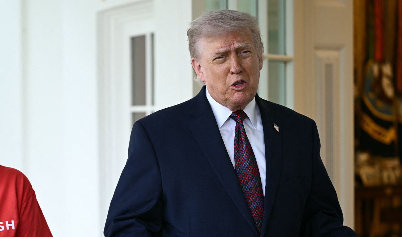 US President Donald Trump speaks to reporters next to a Doordash delivery worker outside the Oval Office at the White House, in Washington, DC, April 13, 2026. (AFP)