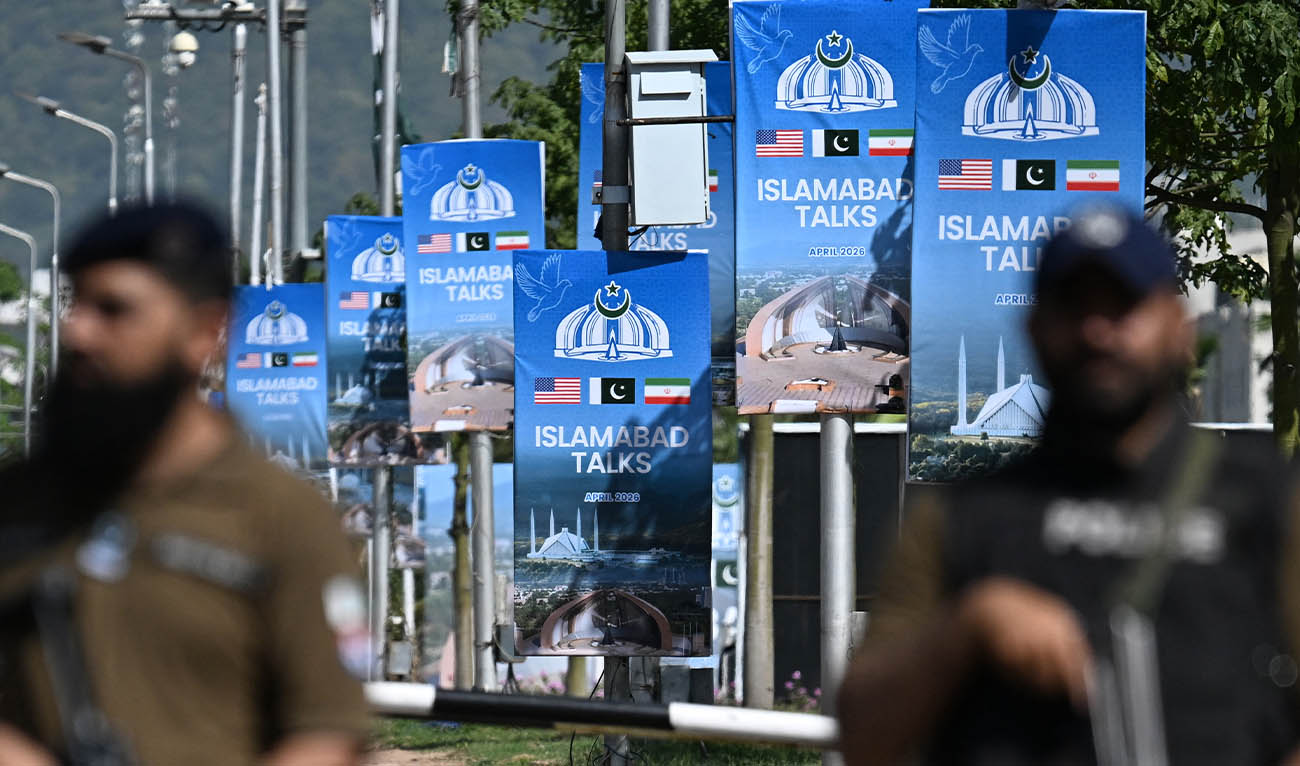 Security personnel stand guard at a security checkpost along a road temporarily closed near the Serena Hotel at the Red Zone area in Islamabad on April 20, 2026, ahead of anticipated US-Iran peace talks. (AFP)