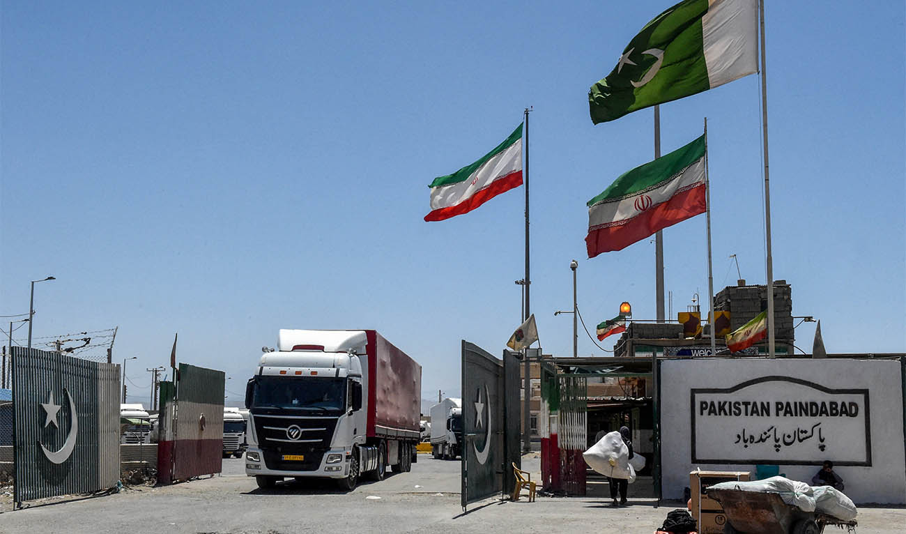 Iranian cargo trucks cross into the Pakistan-Iran border at Taftan, Balochistan province on June 18, 2025, amid the ongoing conflict between Israel and Iran. (AFP/ file)