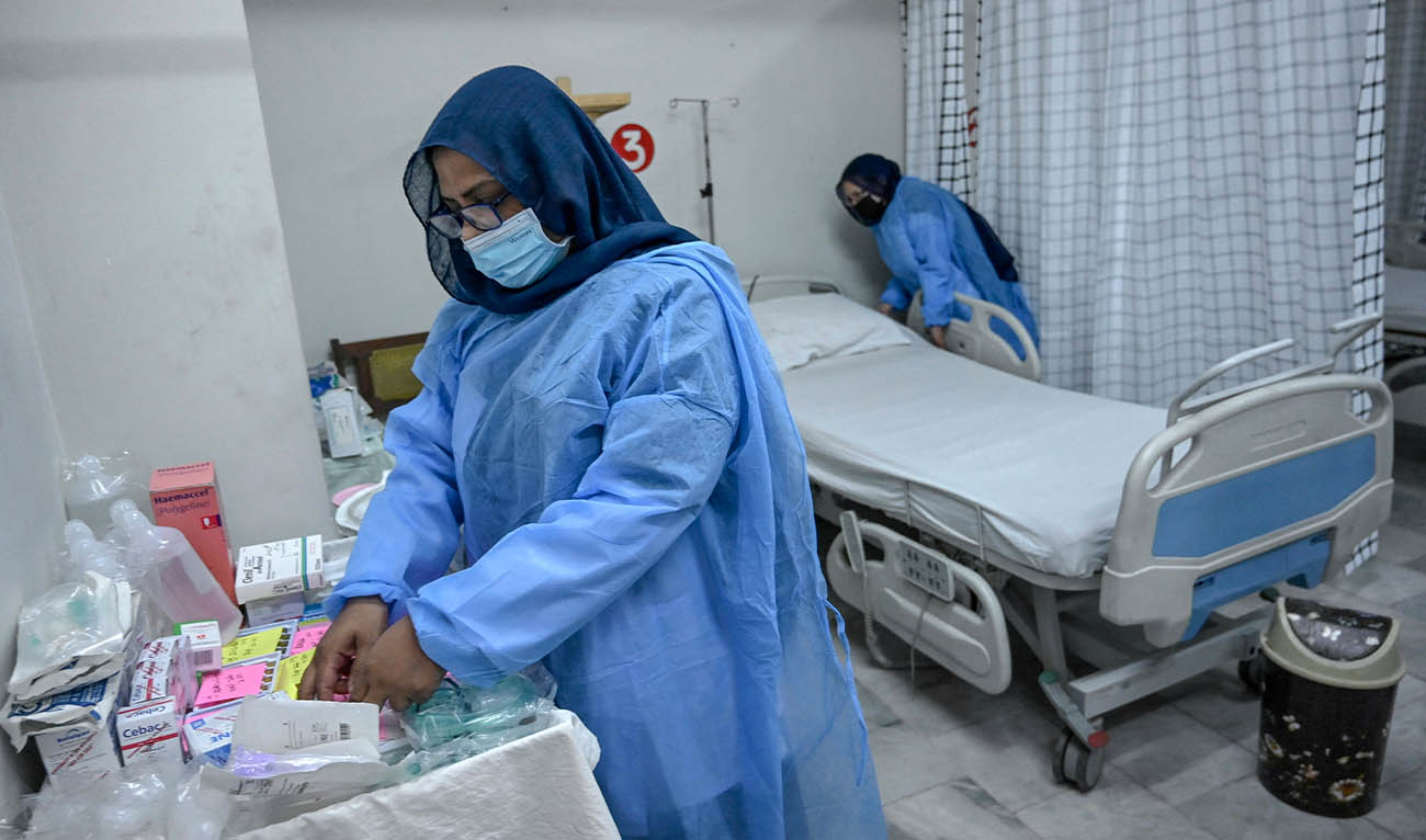 Health workers prepare an isolation ward for mpox patients at the Police and Services hospital in Peshawar on August 20, 2024. (AFP/ file)