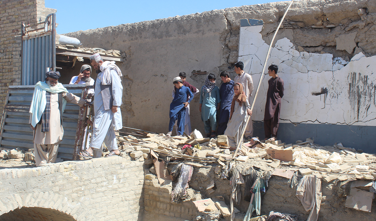 Residents gather at a damaged house after it was struck by a mortar shell in Chaman on April 28, 2026. (AFP)