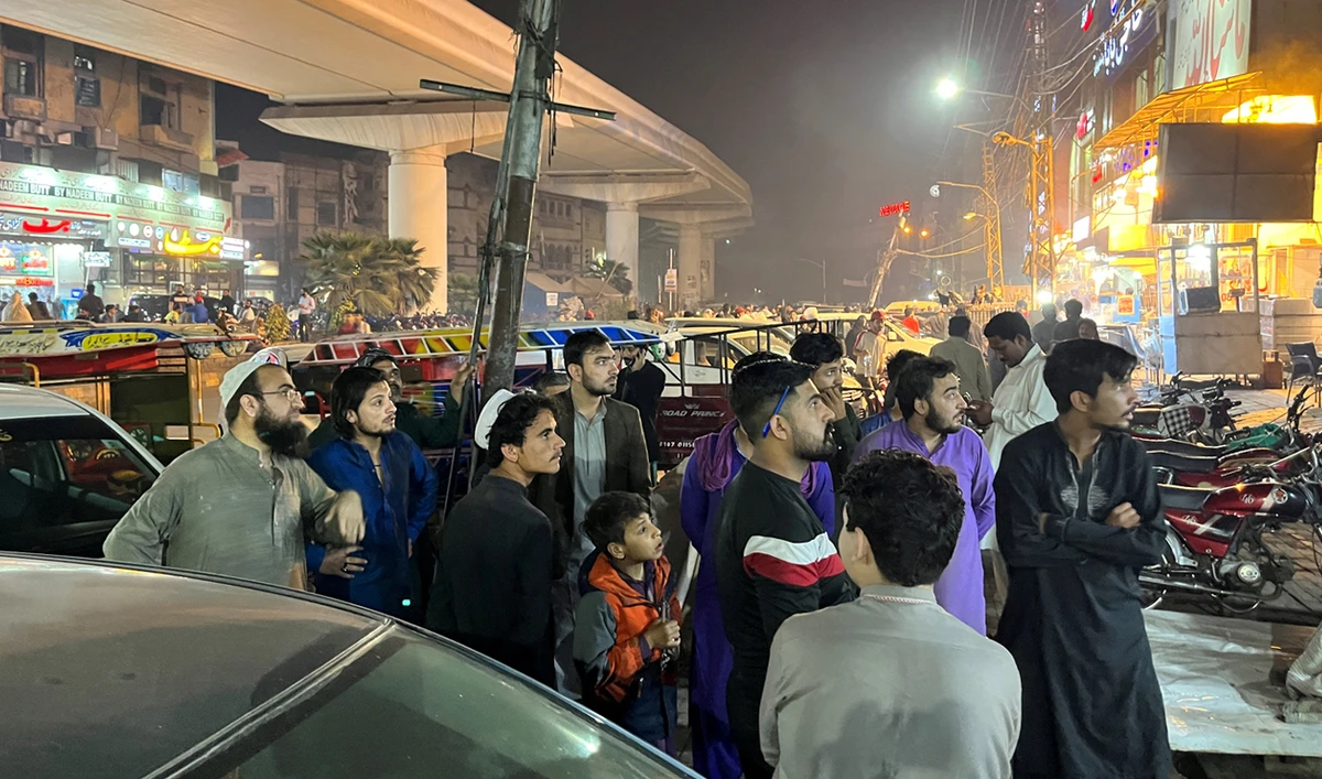 People come out of a restaurant after a tremor was felt in Lahore, Pakistan, on March 21, 2023. (REUTERS/File)