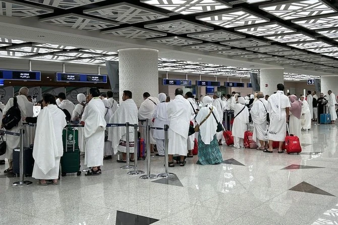 Pilgrims wait to pass through immigration they arrive for the annual Hajj in Makkah at Jeddah International Airport on June 10, 2024. (AFP/ file)