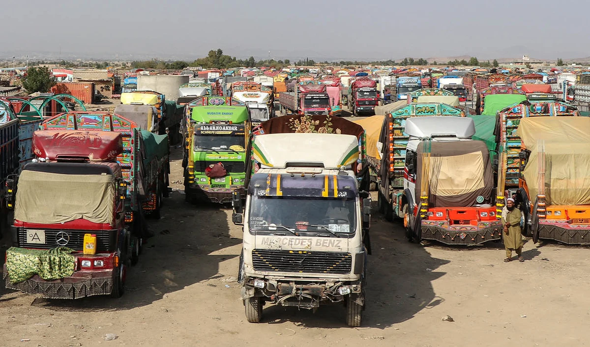 Stranded trucks with goods parked near the closed Ghulam Khan zero-point border crossing between Afghanistan and Pakistan in Gurbuz district in the southeast of Khost province on October 20, 2025. (AFP/ FILE)