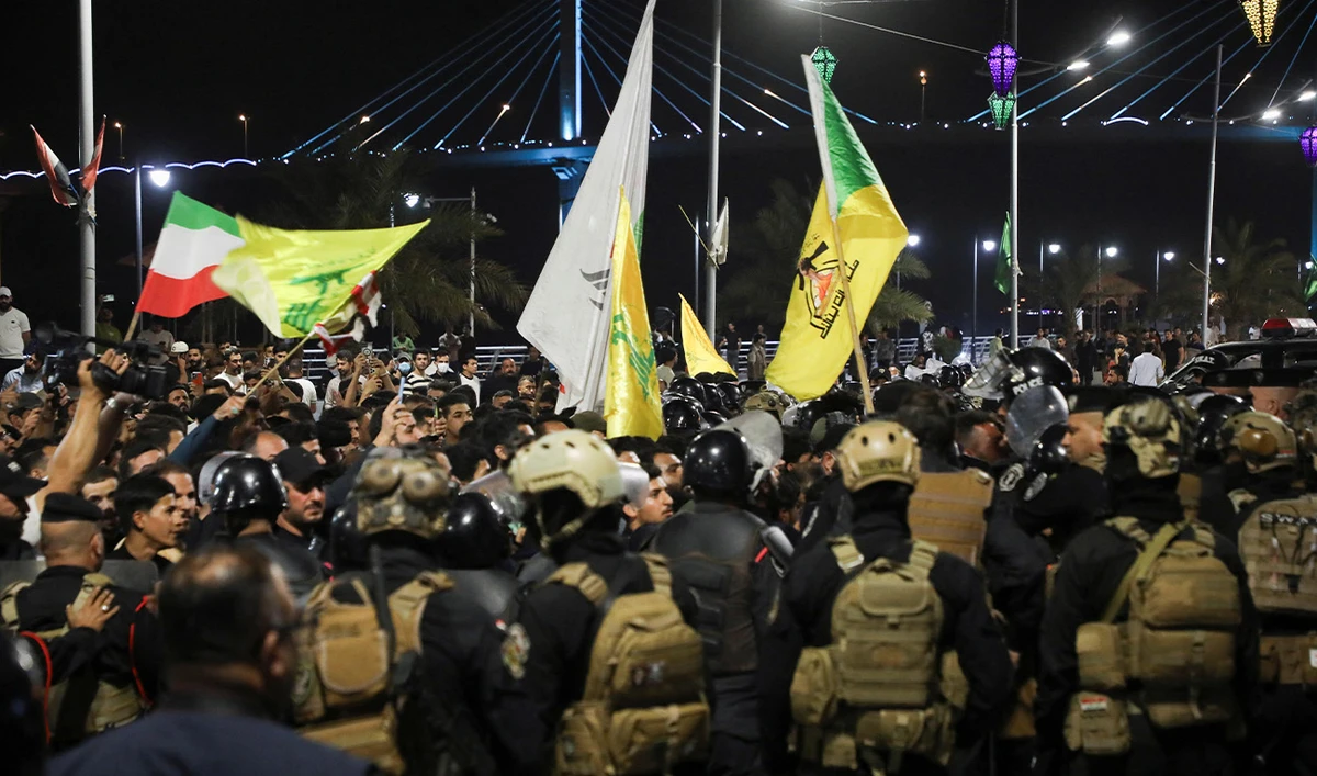 Iraqi security forces try to disperse protesters outside the Kuwaiti consulate after rockets fired from the direction of Kuwait hit a house in Khor al-Zubair, Basra, Iraq, April 7, 2026. (Reuters)