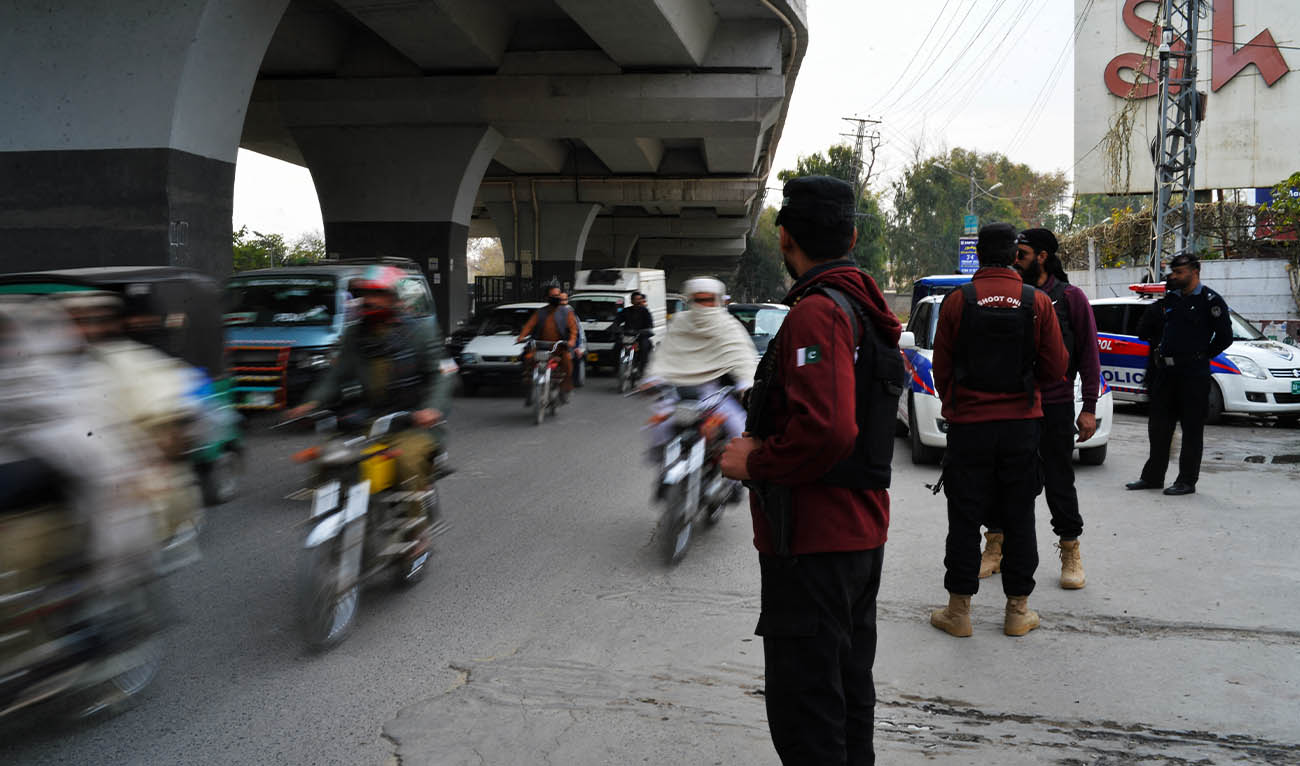 In this picture taken on February 1, 2023, Policemen stand guard along a street in Peshawar day after a mosque suicide blast inside a police headquarters. (AFP/ file)