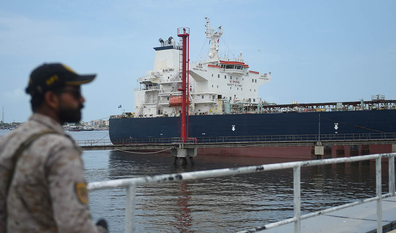 A security personnel stands guard near a Russian cargo ship carrying crude oil docked at the Karachi port in Karachi on June 28, 2023. (AFP/ file)