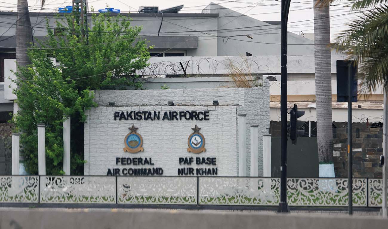 The logos of the Federal Air Command and PAF Base Nur Khan are seen through a car windshield on a wall, as Pakistan offers to help mediate talks between the United States and Iran, amid the U.S.-Israeli conflict with Iran, in Rawalpindi, Pakistan, March 26, 2026. (REUTERS)