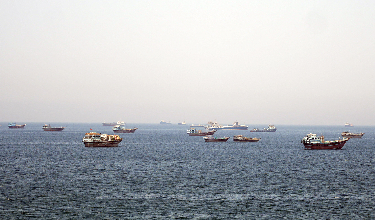 The photograph taken on May 8, 2026, shows vessels stranded in the Strait of Hormuz near Musandam, Oman. (REUTERS)
