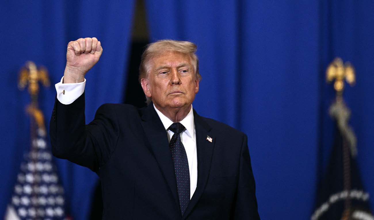 US President Donald Trump raises a fist as he departs after delivering a speech about the economy at Rockland Community College Fieldhouse in Suffern, New York, on May 22, 2026. (AFP/ file)