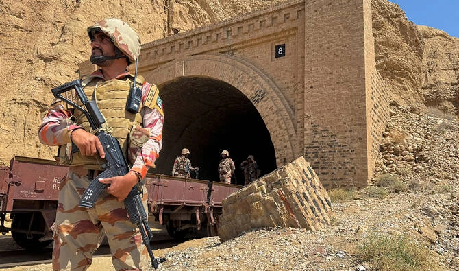 Pakistan army soldiers stand at a tunnel where the Jaffar Express train was attacked by separatist militants, in Bolan, Balochistan, Pakistan, on March 15, 2025. (Reuters/File)