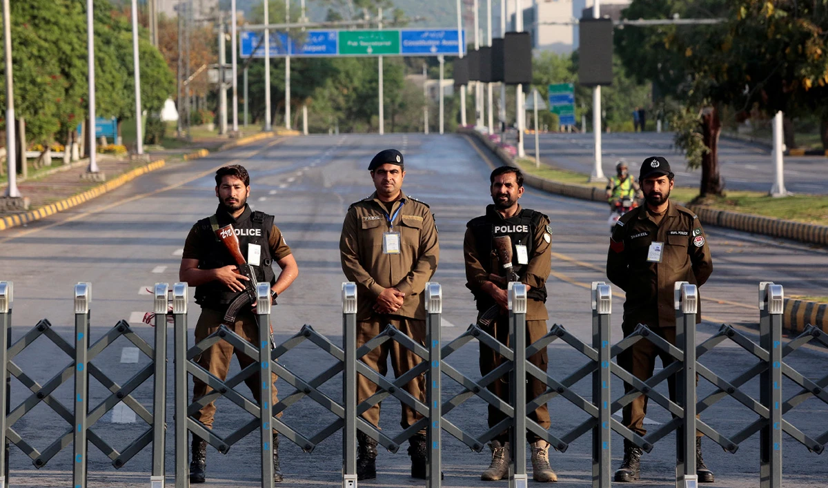 Police officers stand guard behind a barricade near Serena Hotel in Islamabad, Pakistan on April 25, 2026. (Reuters/File)