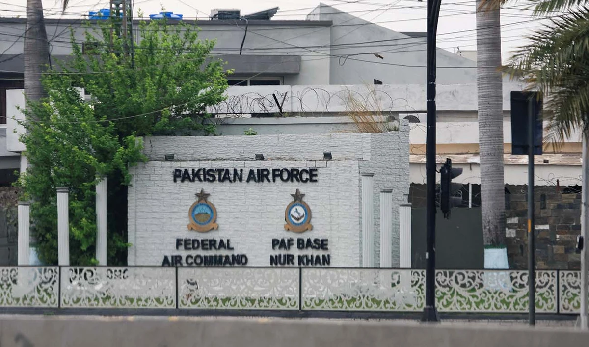 The logos of the Federal Air Command and PAF Base Nur Khan are seen through a car windshield on a wall, as Pakistan offers to help mediate talks between the United States and Iran, amid the U.S.-Israeli conflict with Iran, in Rawalpindi, Pakistan, March 26, 2026. (REUTERS)