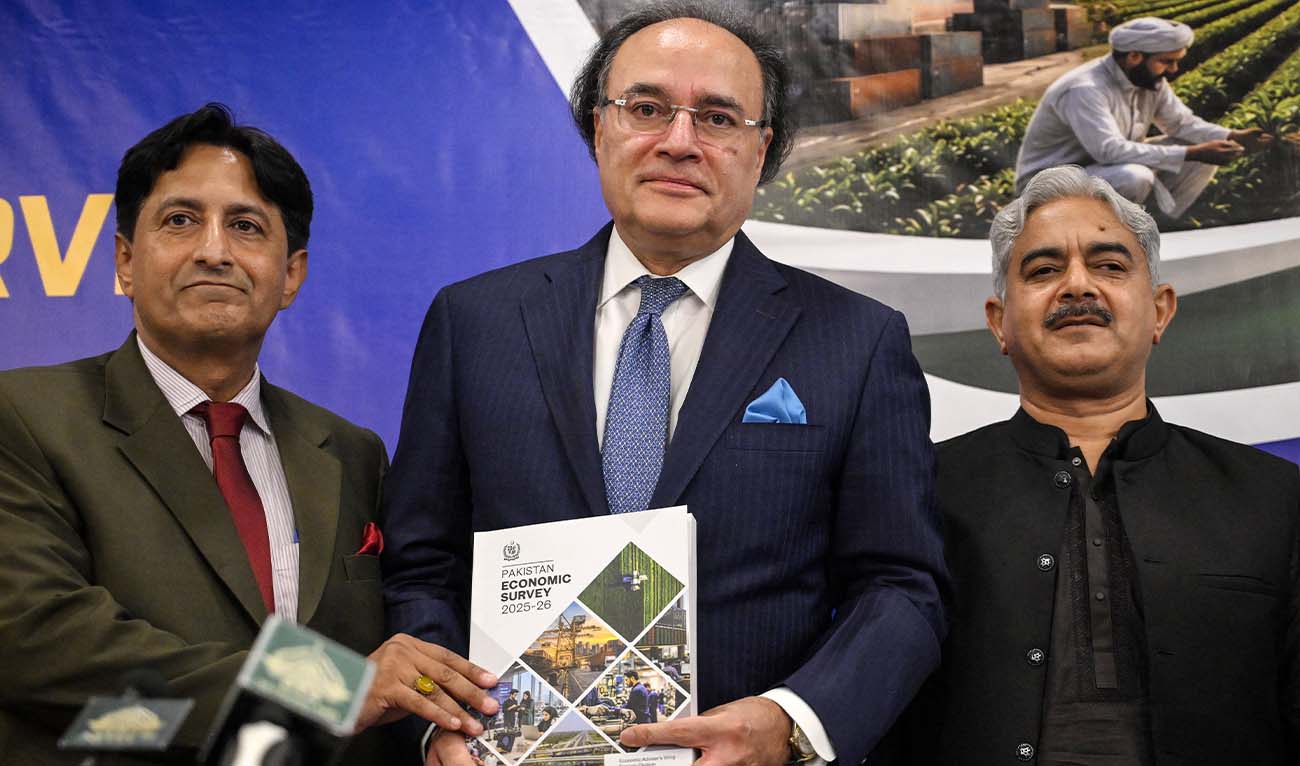Pakistan's Finance Minister Muhammad Aurangzeb (C) releases a copy of the country's Economic Survey 2025-26 ahead of the state budget during a press conference in Islamabad on June 11, 2026. (AFP)