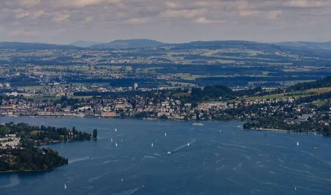 This photograph taken from the luxury Burgenstock resort, central Switzerland, shows Lake Lucerne and the city of Lucerne on June 16, 2024. (AFP/File)