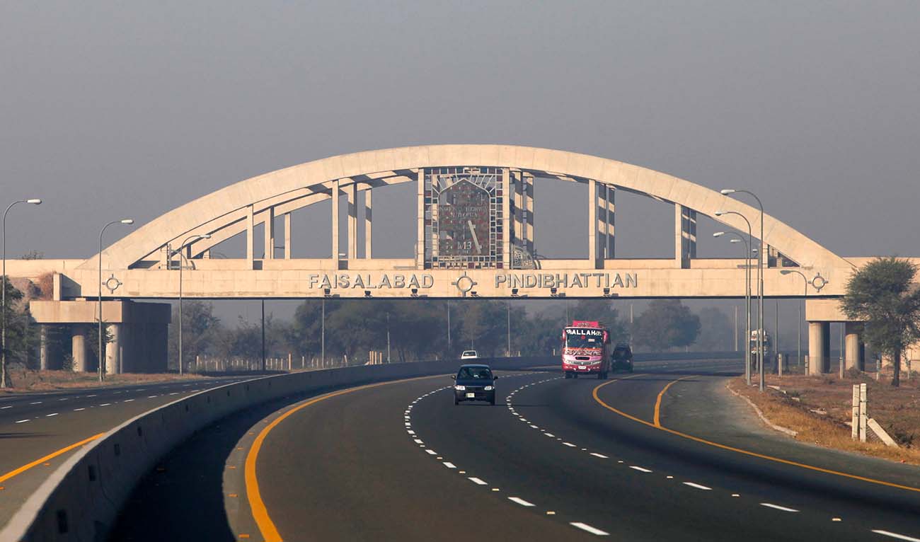 Vehicles pass under the Faisalabad interchange bridge on the M2 motorway near Pindibhattian December 13, 2009. If you want a slice of peace and stability in a country with a reputation for violence and chaos, try Pakistan's M2 motorway. (Reuters/ file)