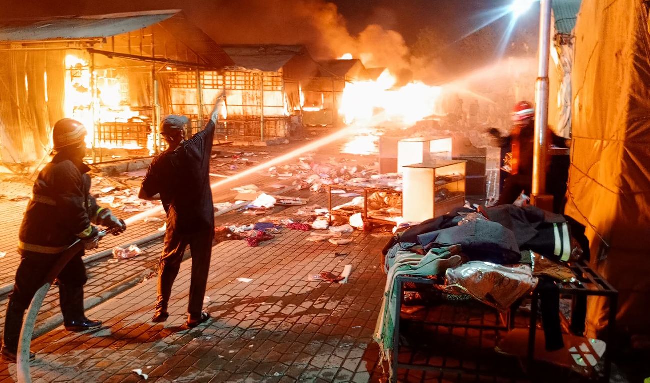 Firefighters try to extinguish a fire that erupted at a weekly market in Islamabad on June 23, 2026. (District Administration)