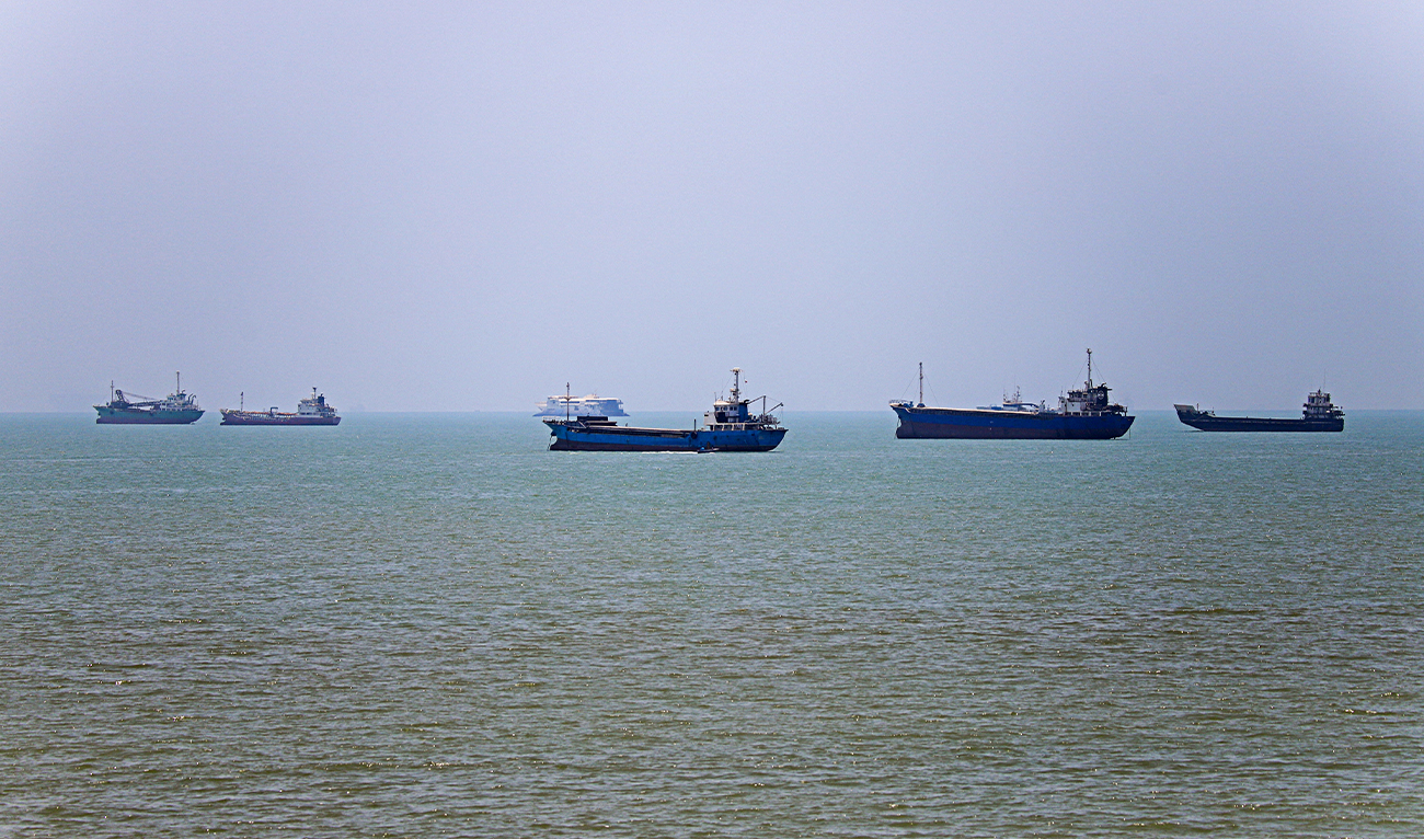 In this picture obtained from Iran’s ISNA news agency on June 18, 2026, vessels are seen anchored in Bandar Abbas along the Strait of Hormuz. (AFP)