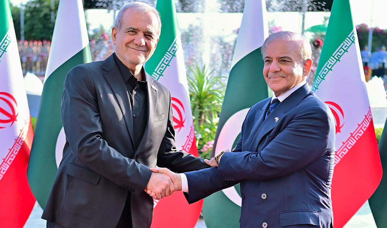 This handout photograph taken on June 23, 2026 and released by Pakistan's Prime Minister's Office shows Iran's President Masoud Pezeshkian (L) shaking hands with Pakistan's Prime Minister Shehbaz Sharif during his ceremonial reception at the Prime Minister House in Islamabad. (AFP)