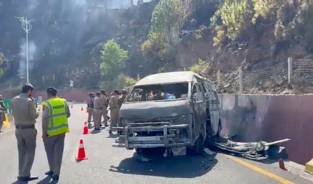 Motorway police officials stand at the site of a road accident on the Murree Expressway in Murree, Pakistan, on June 10, 2026. (Screengrab/X/@FauziaKalsoom)