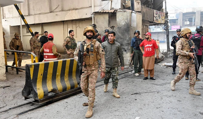 Army personnel inspect the suicide attack site outside the border force headquarters in Peshawar on November 24, 2025. (AFP/File)
