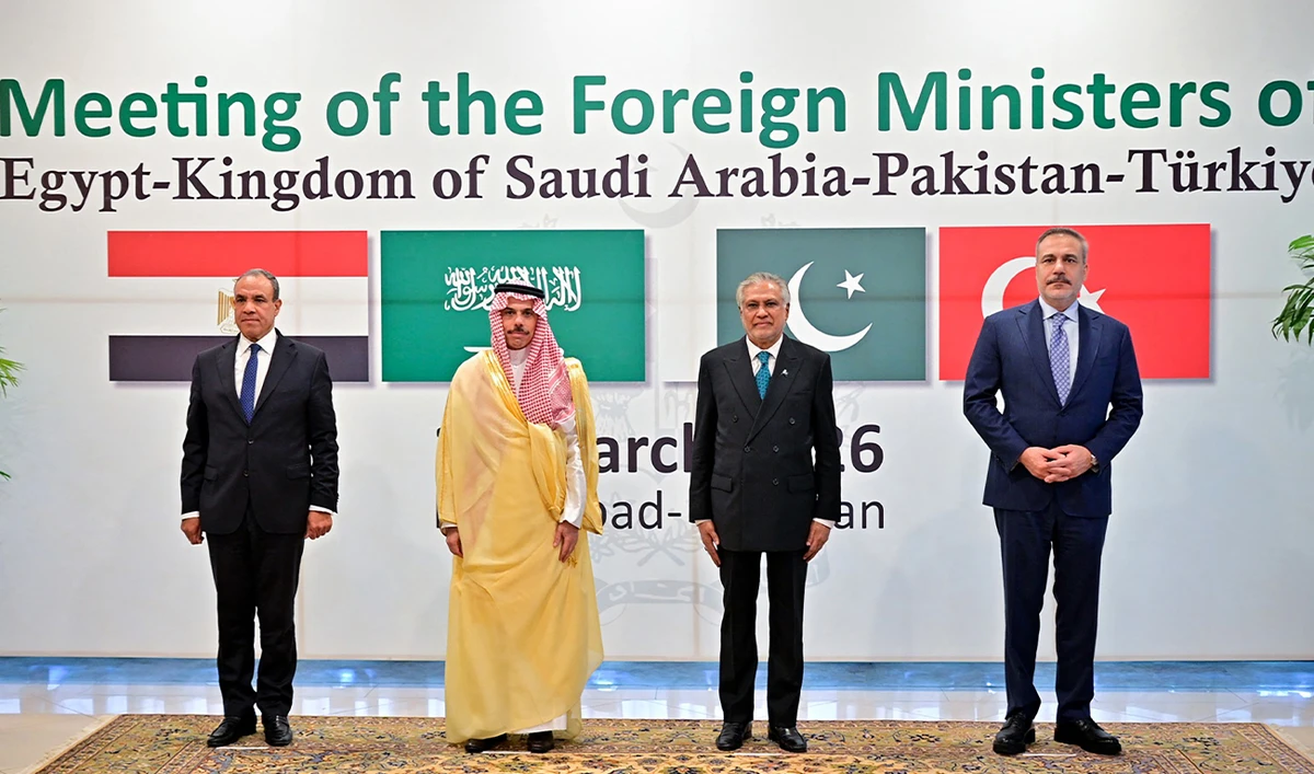 The photograph shows Pakistan’s Foreign Minister Ishaq Dar (second right) posing for a photograph with his counterparts, Turkiye’s Hakan Fidan (right), Saudi Arabia’s Faisal bin Farhan (second left), and Egypt’s Badr Abdelatty, before their meeting at the Foreign Ministry office in Islamabad, Pakistan, on March 29, 2026. (AFP/Foreign Office/File)